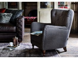 Alexander & James Hansel Chair upholstered in Beagle Bourbon fabric displayed in a living room