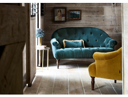 Alexander & James Imogen 2 Seater Sofa upholstered in Lavish Emerald (Plain) fabric displayed in a modern living room 